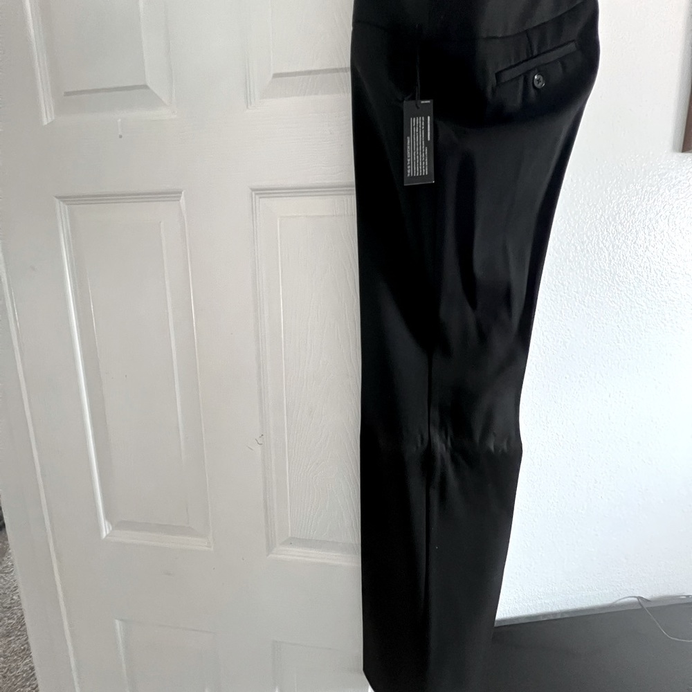 Women’s business pants from Express brand is editor.  Color is black. Size 6